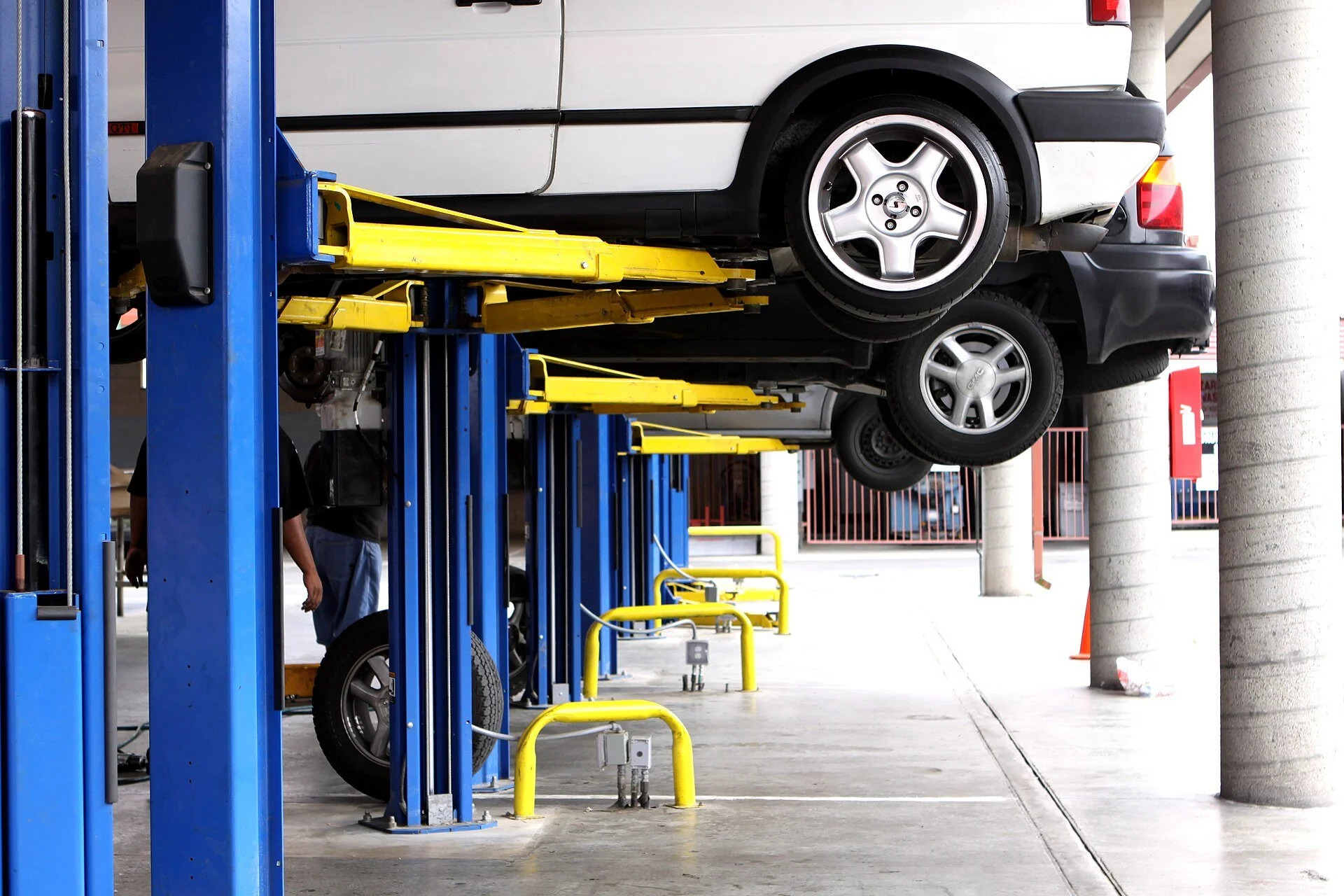 Vehicle lifts inside a California vehicle maintenance facility