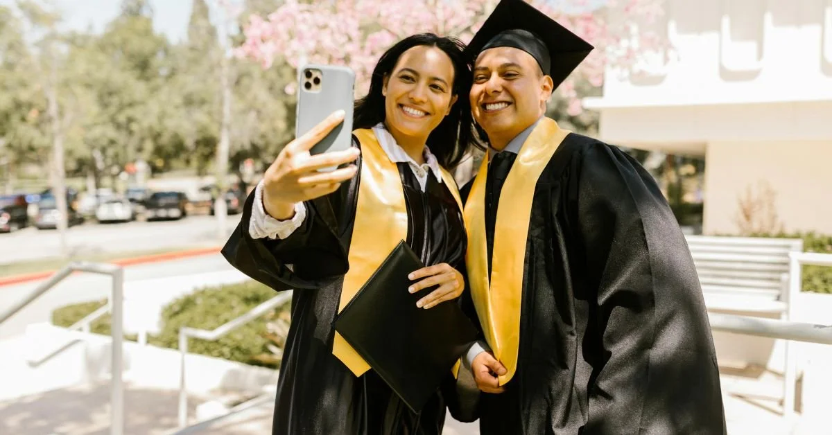 Two graduates taking a selfie