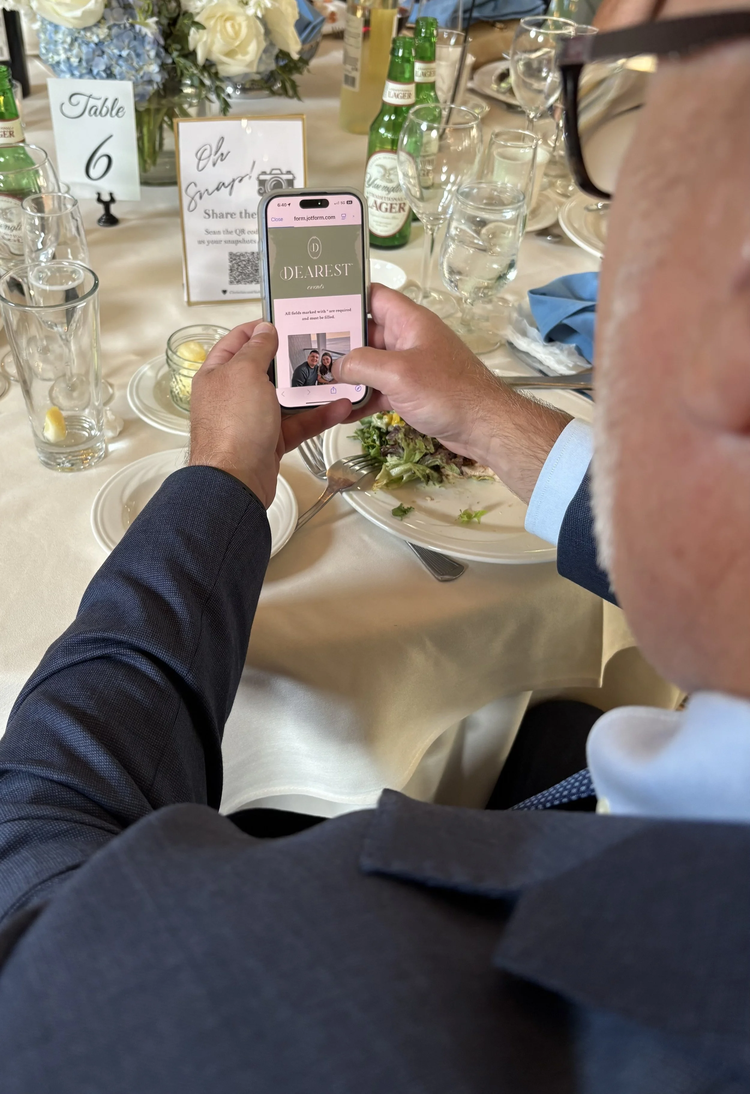 Man scanning a QR Code to upload photos