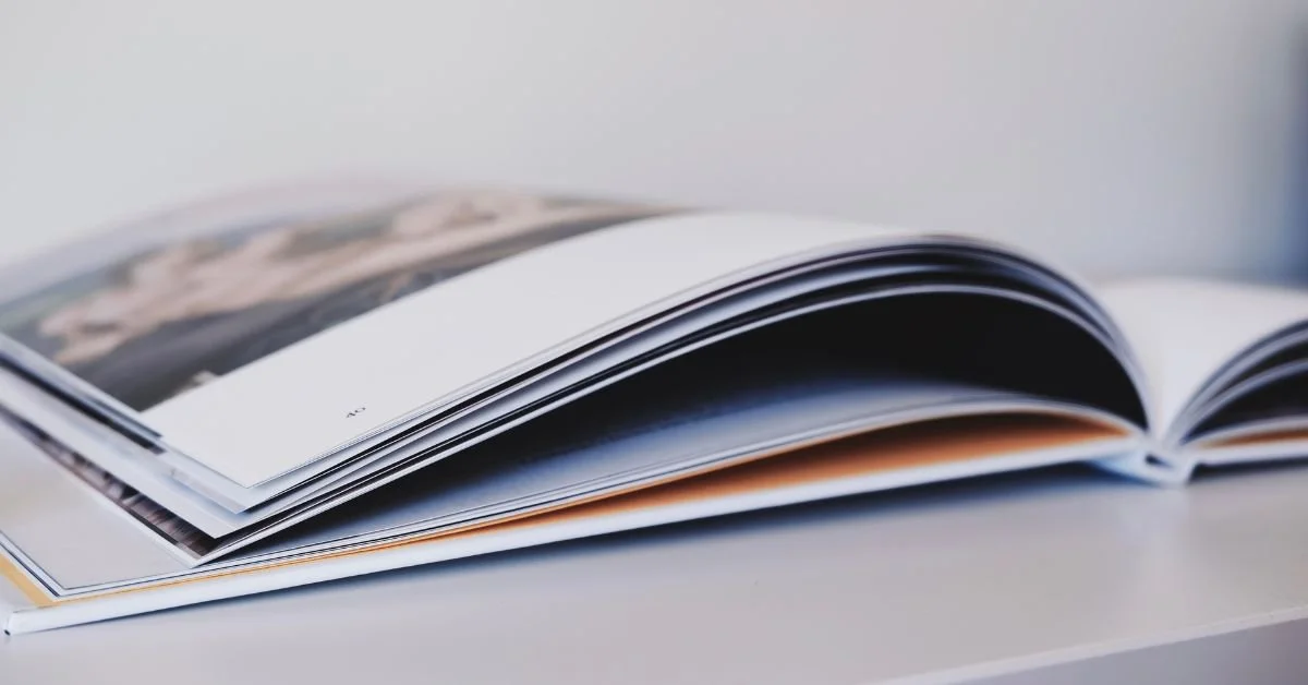 An open photo book flat lay