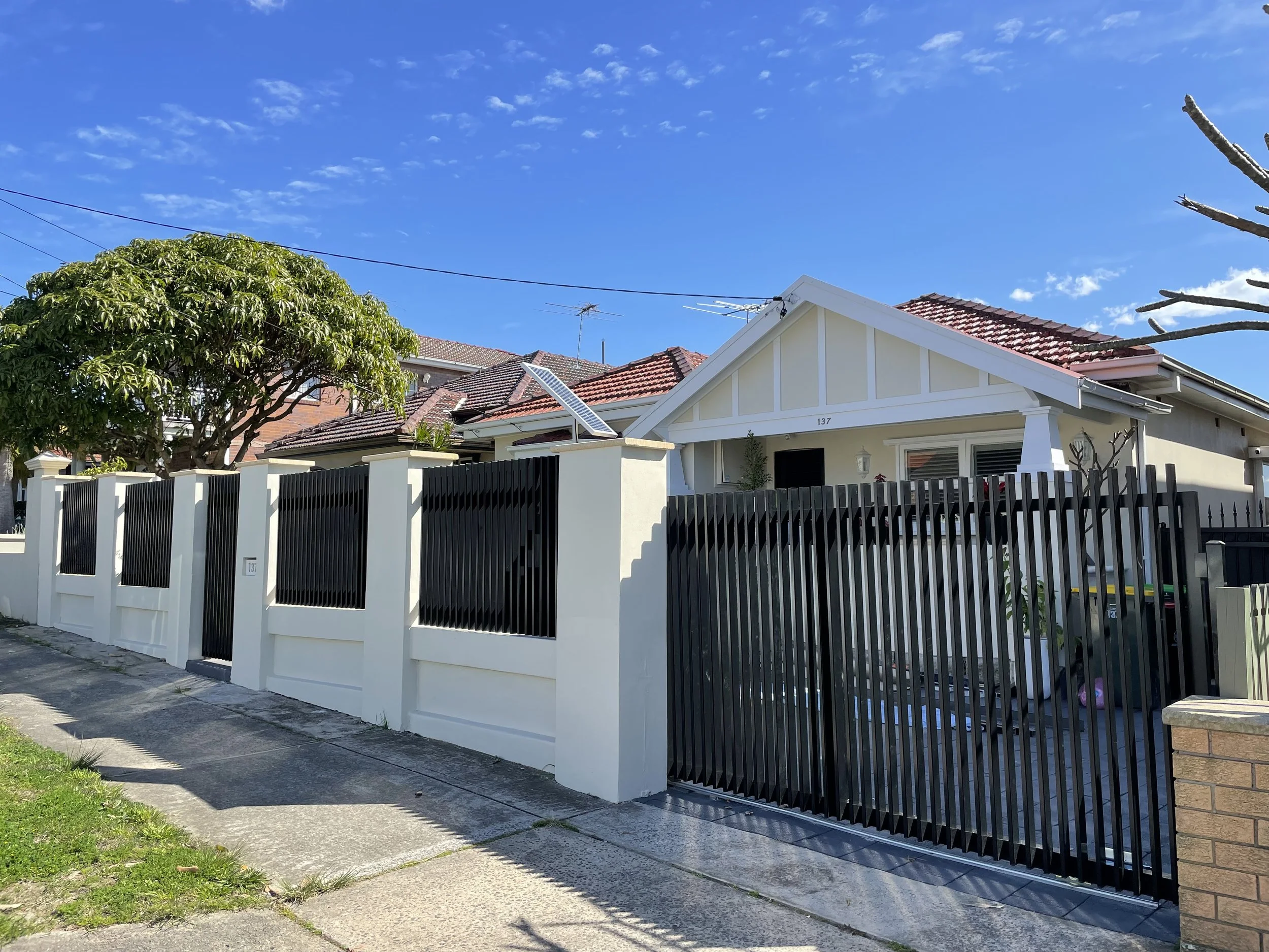 Modern aluminium front fence in Earlwood