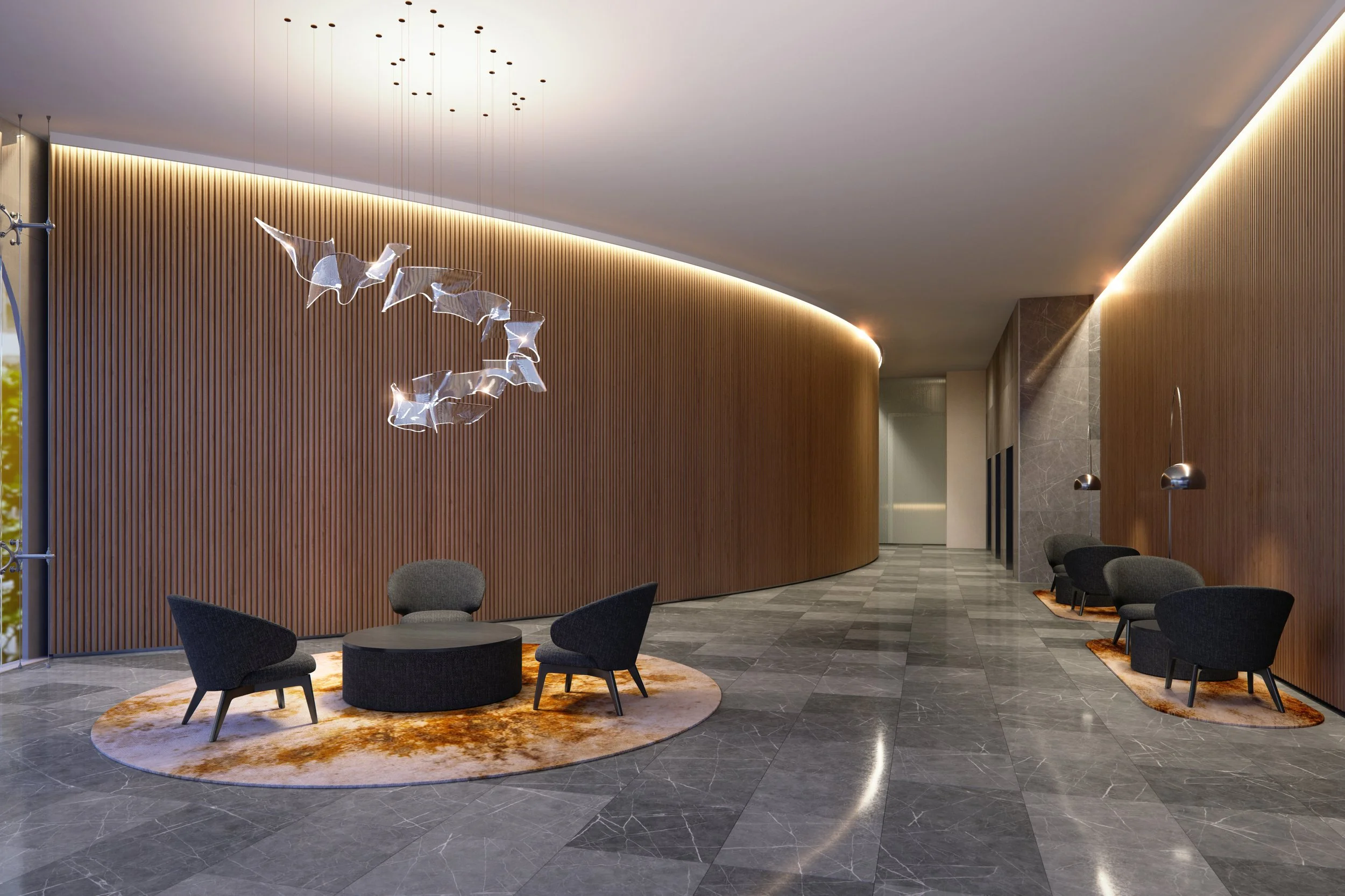 Modern Forum West lobby with curved wooden wall, circular seating area with three chairs and a rug, grey marble floor, and unique hanging light fixtures.