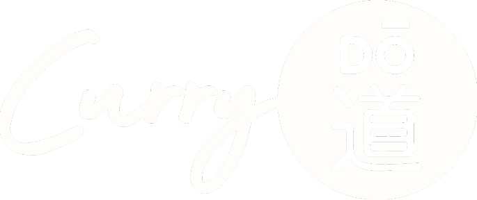 The phrase 'Curry Dō' in stylized white font on a black background, with a white circle containing Japanese characters.