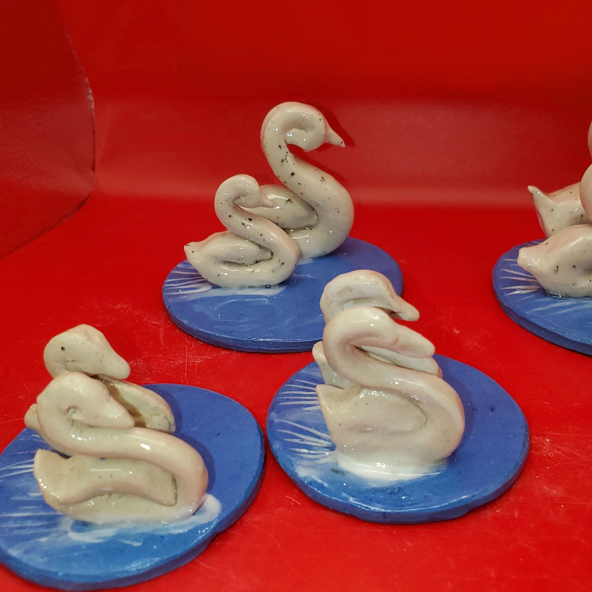 Elegant Ceramic Swans on a Lake
