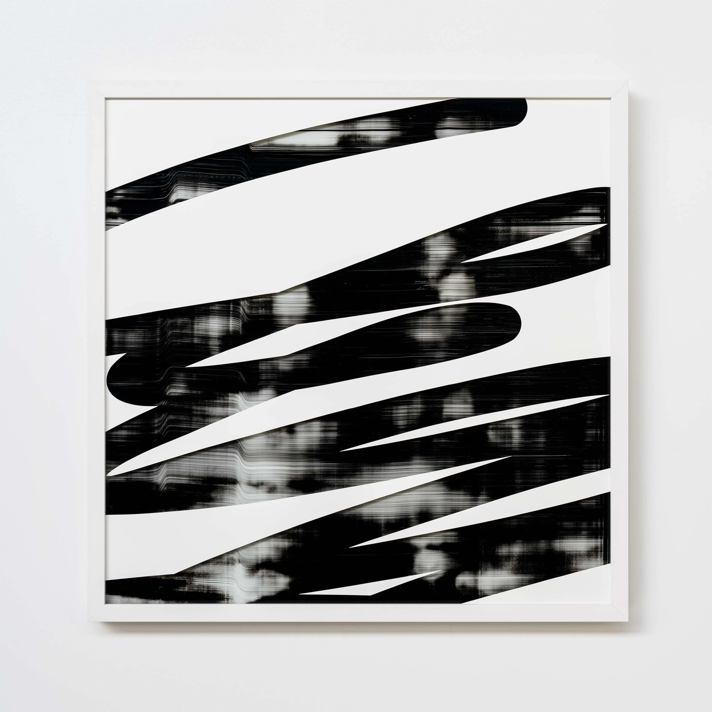 Christchurch, New Zealand artist, Nathan Ingram's  Abstract black and white striped artwork in a white frame on a white wall.