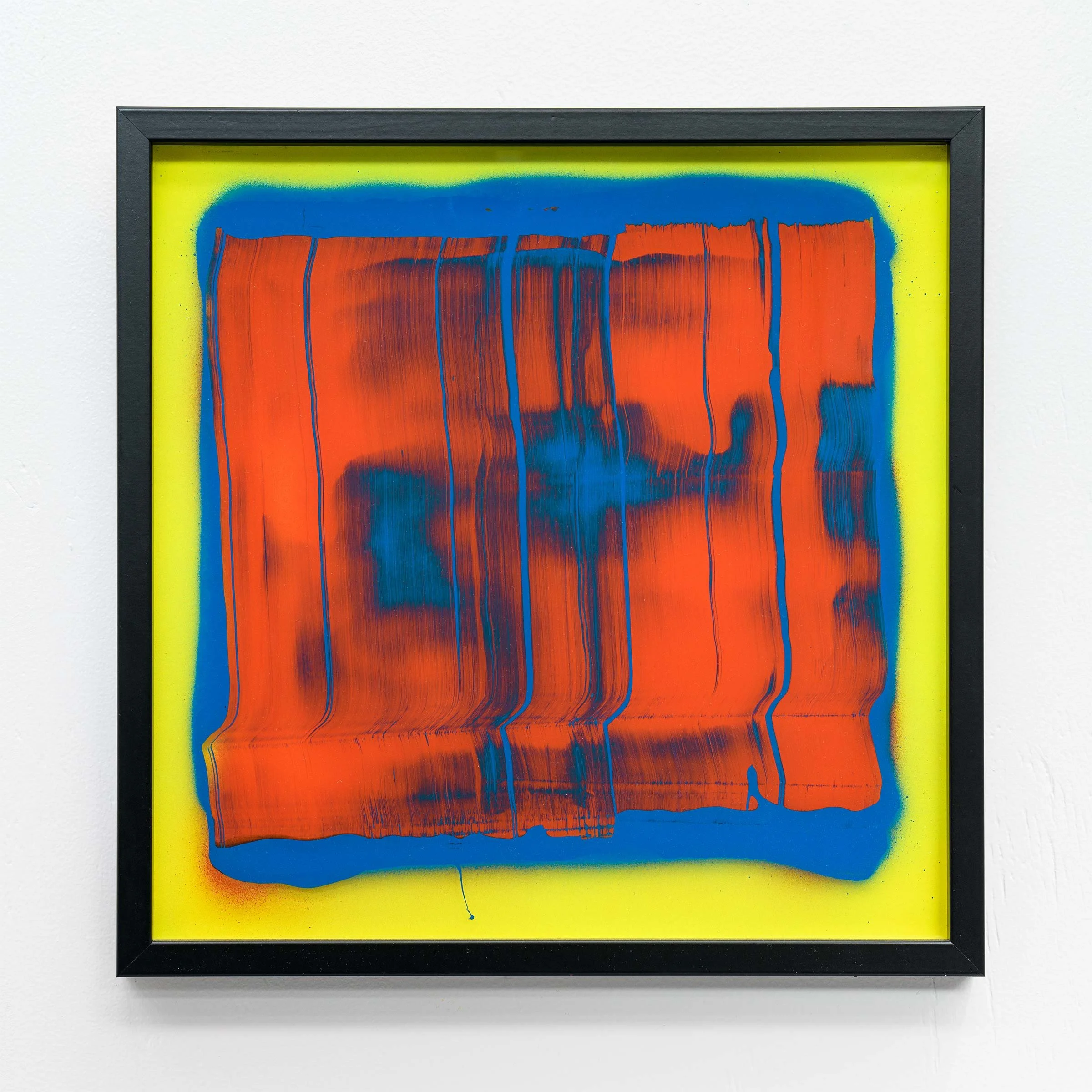 Abstract painting with orange, blue, and yellow colors on canvas framed in black.