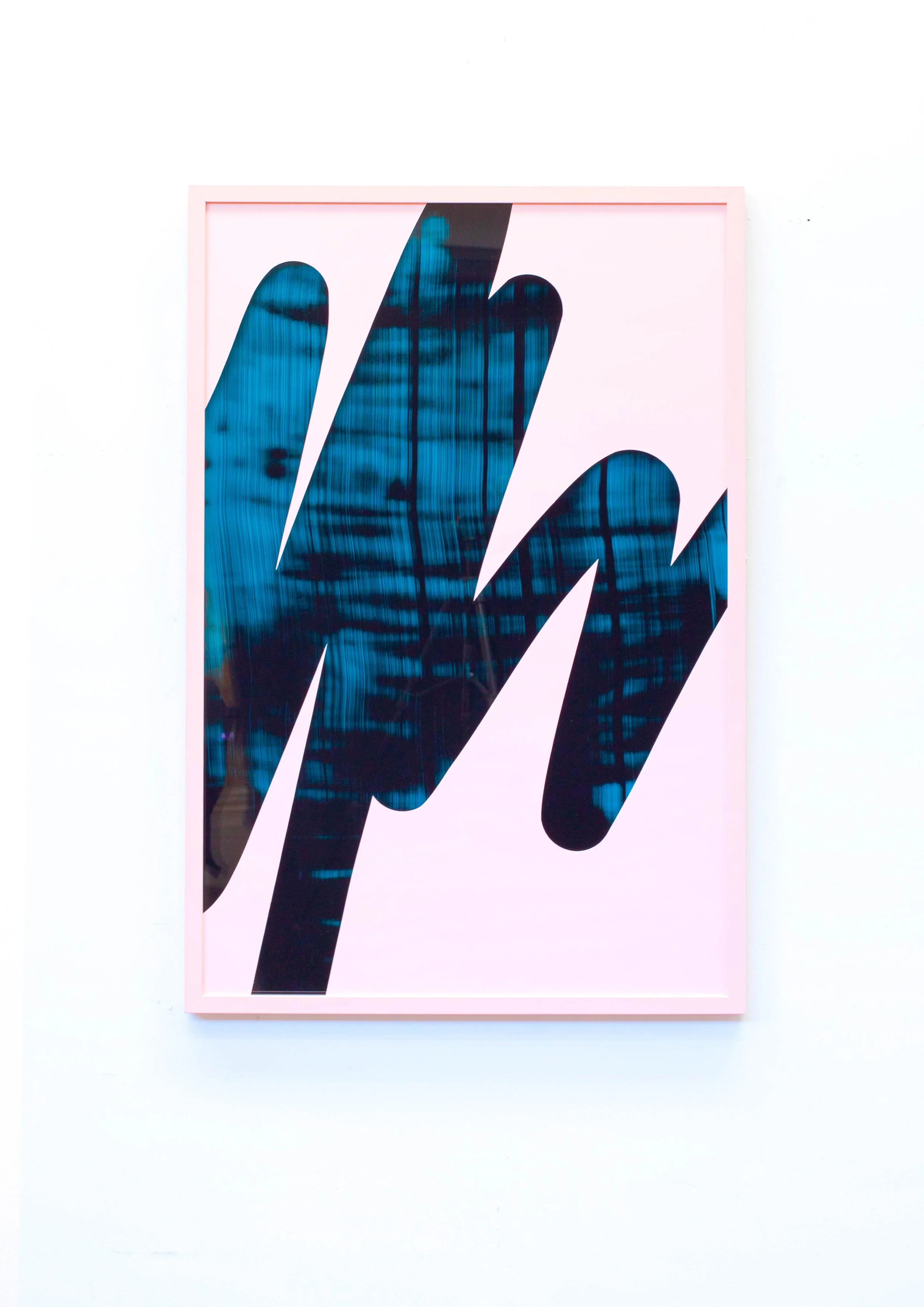 Abstract artwork with black and blue jagged shapes on a light pink background, framed with a pink border.