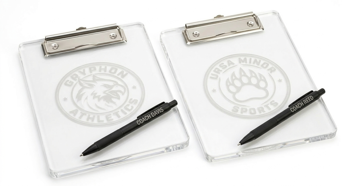 Two clear acrylic clipboards with logos, each with a black marker labeled 'Coach Davis' placed on top, on a white background.