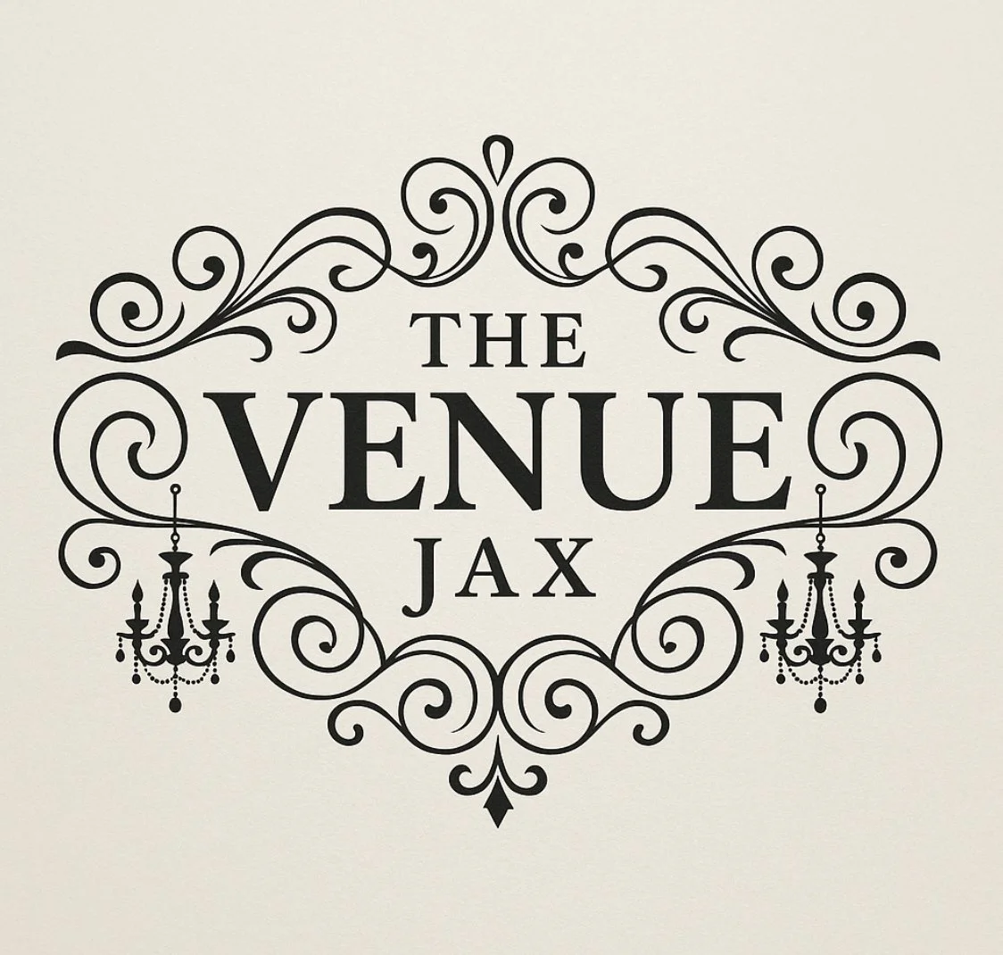 Decorative black text design reading 'The Venue Jax' with ornate swirl patterns and two chandeliers on a light background.