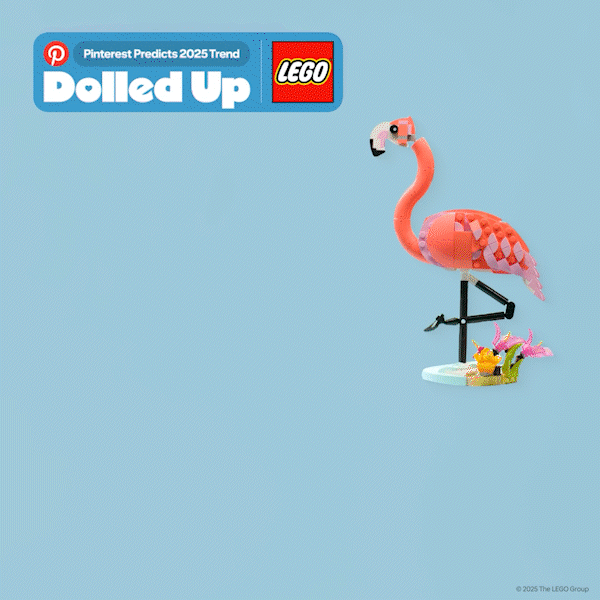 Stop motion animation of LEGO pink flamingo made with LEGO bricks standing on a black stand with a small yellow chick and pink flowers on a white base against a light blue background, with a Pinterest and LEGO logo banner at the top.