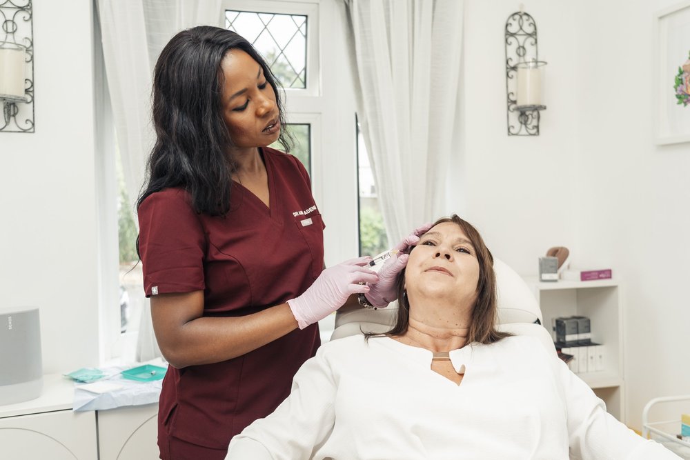 Dr Amina Adeniran treating a patient at the clinic