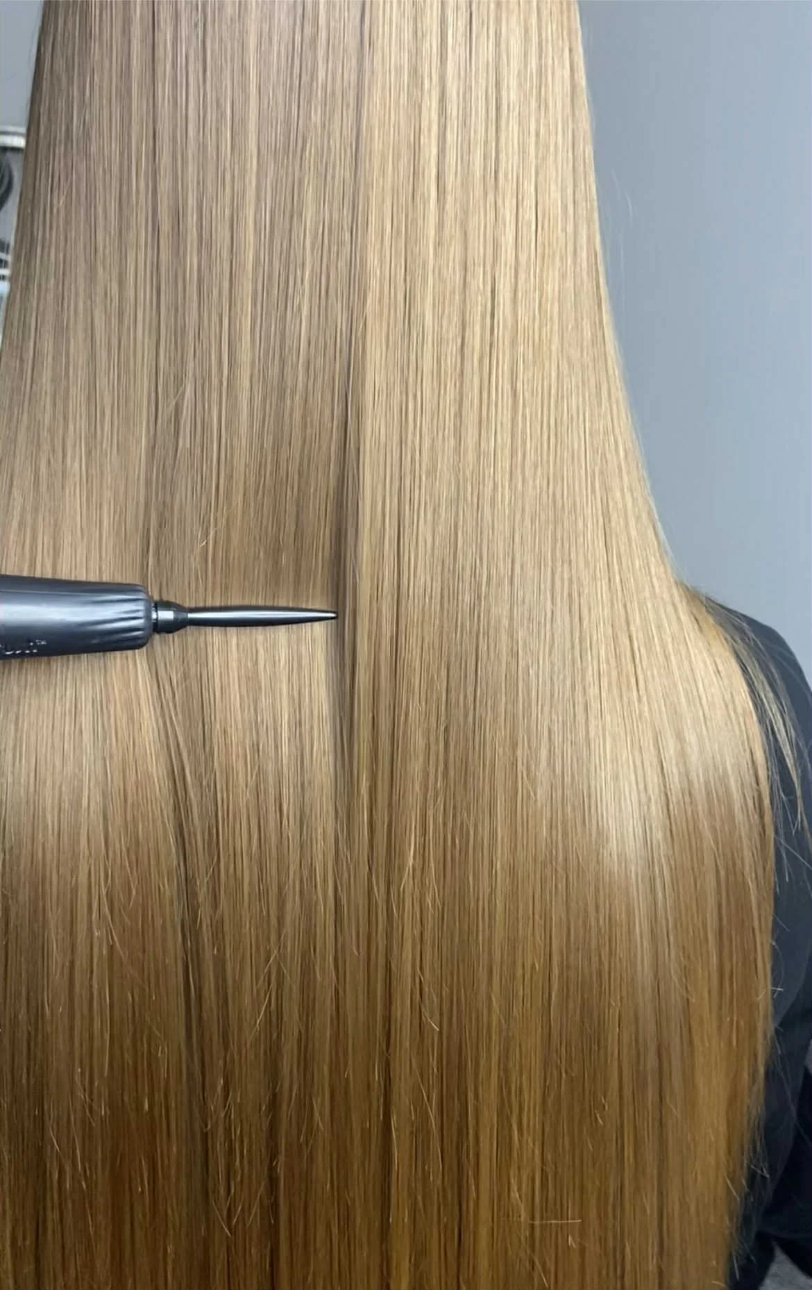 Close-up of smooth, wavy blonde hair.