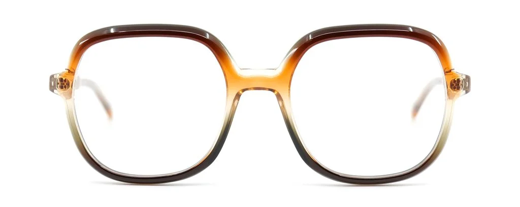 Tortoiseshell patterned eyeglasses with large square frames.