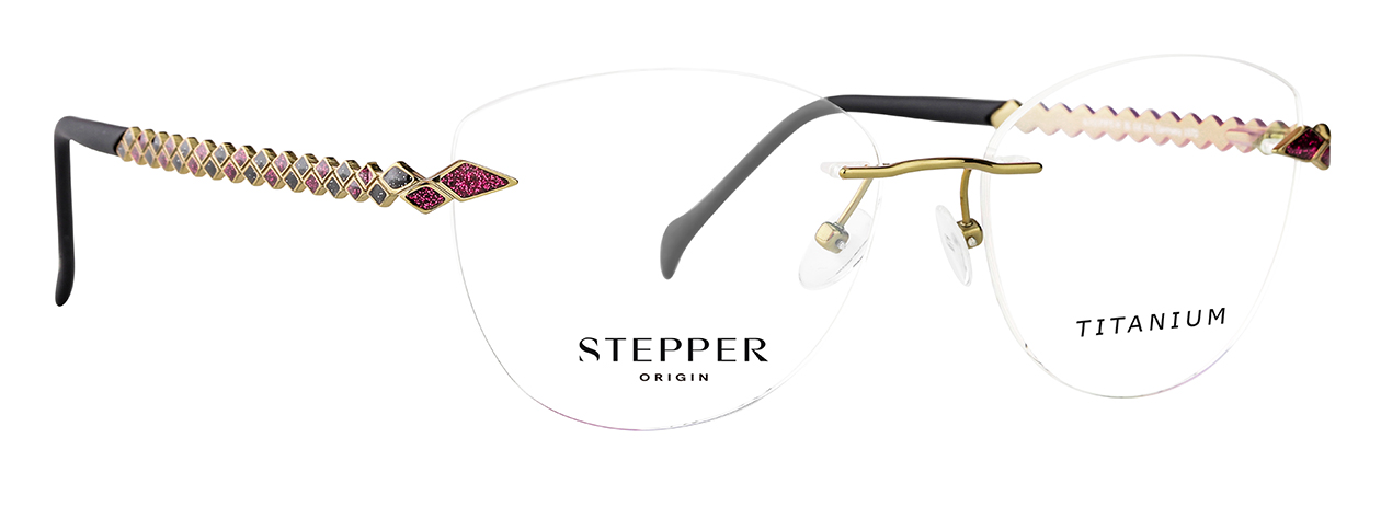 Close-up of fashionable designer sunglasses with pink and gold zigzag patterned temples and a titanium label on the lenses.