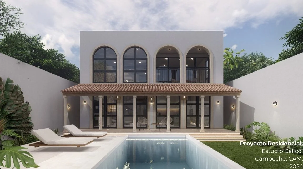 Modern residential house with a swimming pool in front, two white lounge chairs, and a lush garden with green plants on the sides.