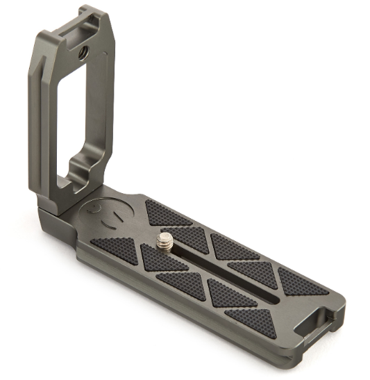 A camera quick release plate with a sliding mechanism and rubber grips.