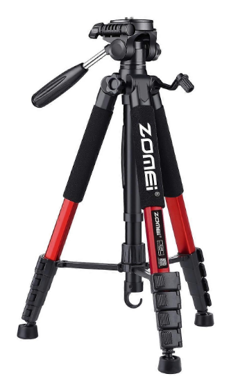 A black and red zoom brand tripod with a handle for adjusting, standing on three legs with rubber feet.