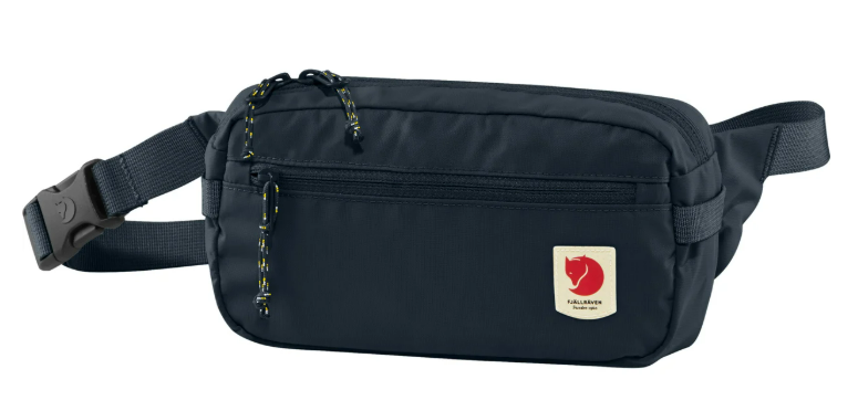 Black waist bag with adjustable strap, zipper pocket, and a small red fox logo patch.