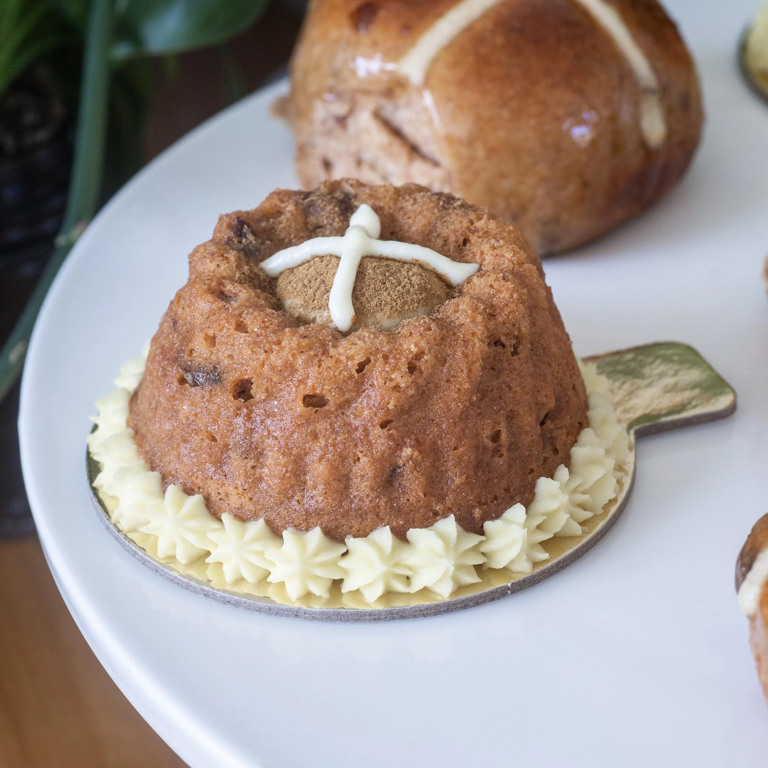 a close up of a Zuckerhaus hot cross bundt petit gateau