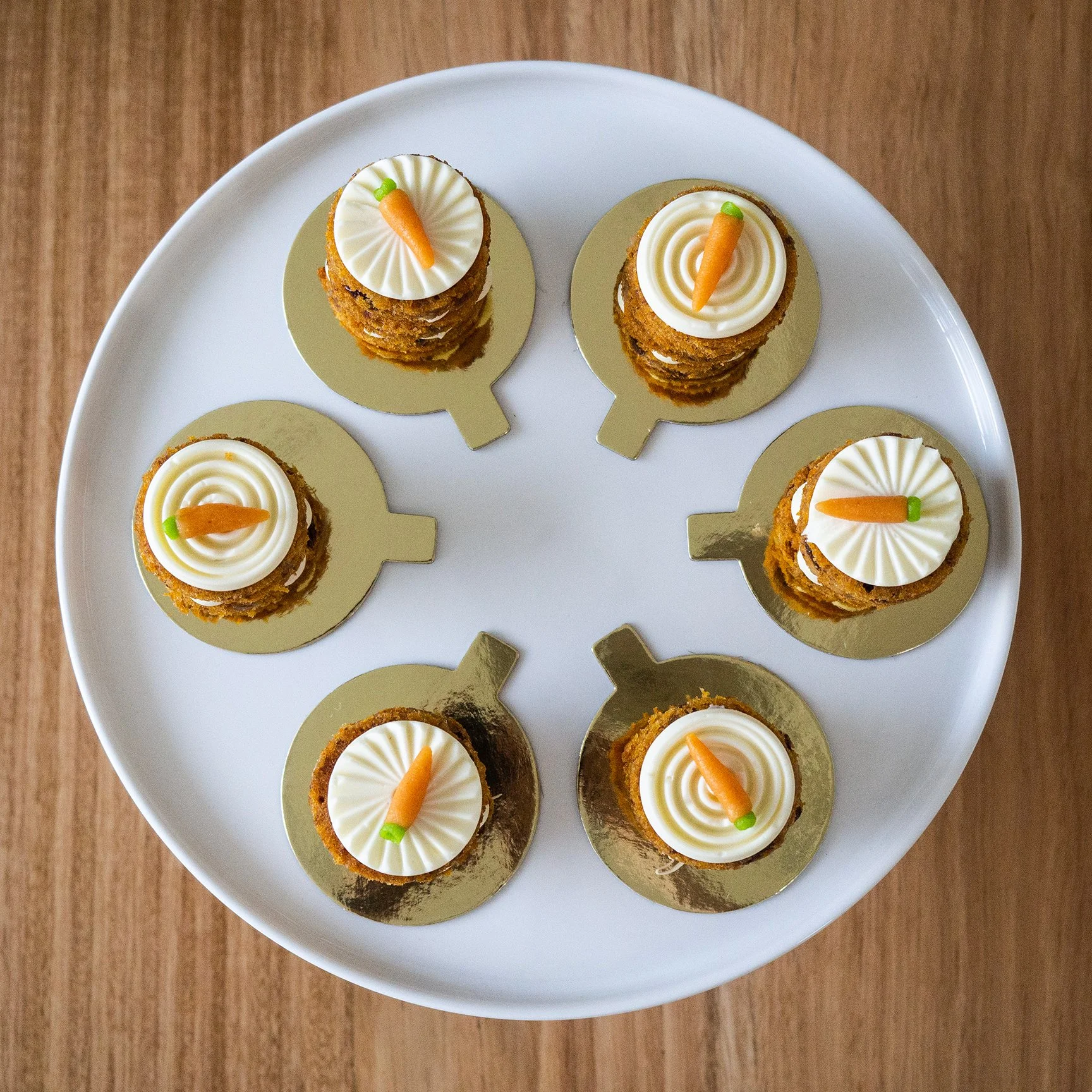 six mini carrot cakes viewed from above