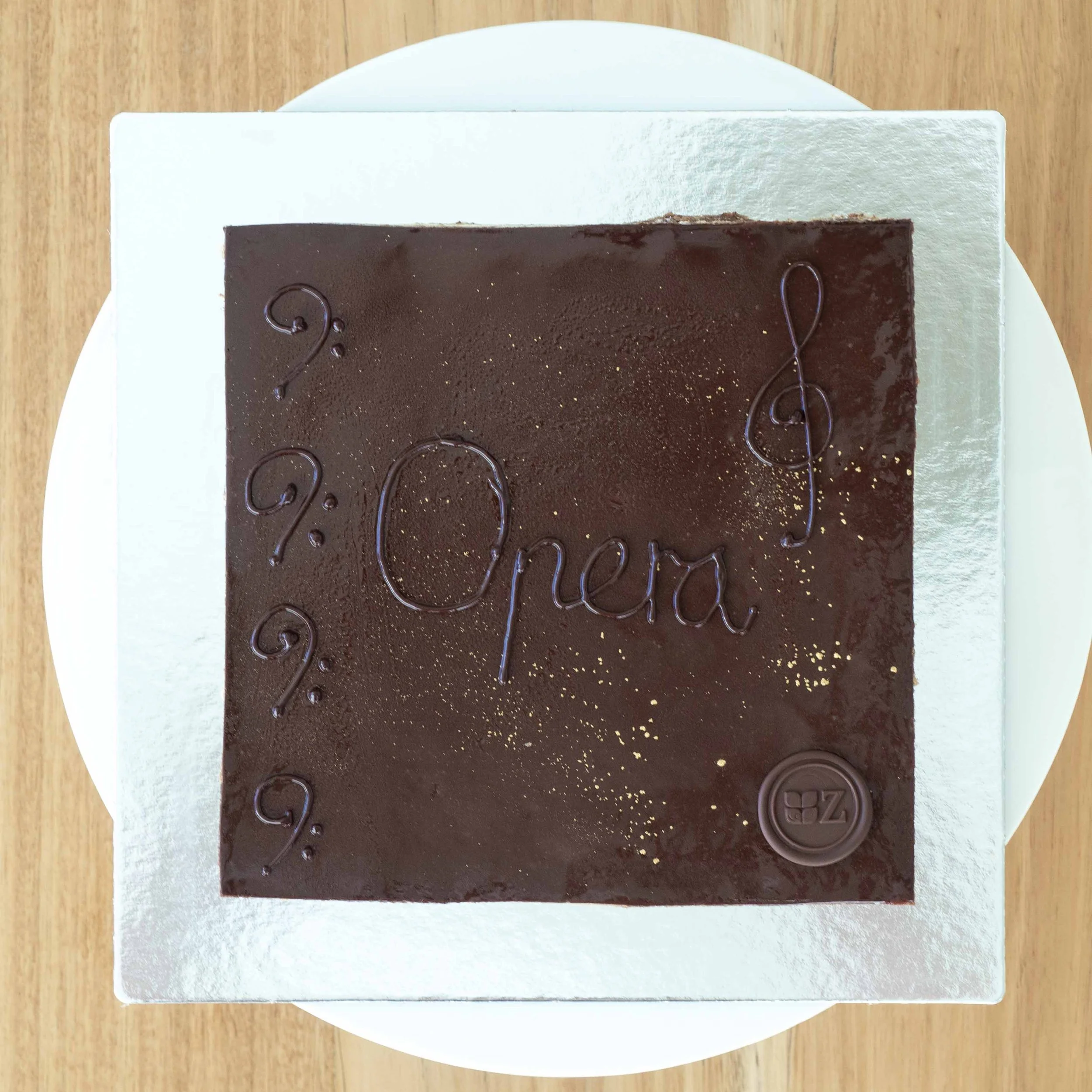 the view from above of a multi-layered coffee and chocolate opera cake