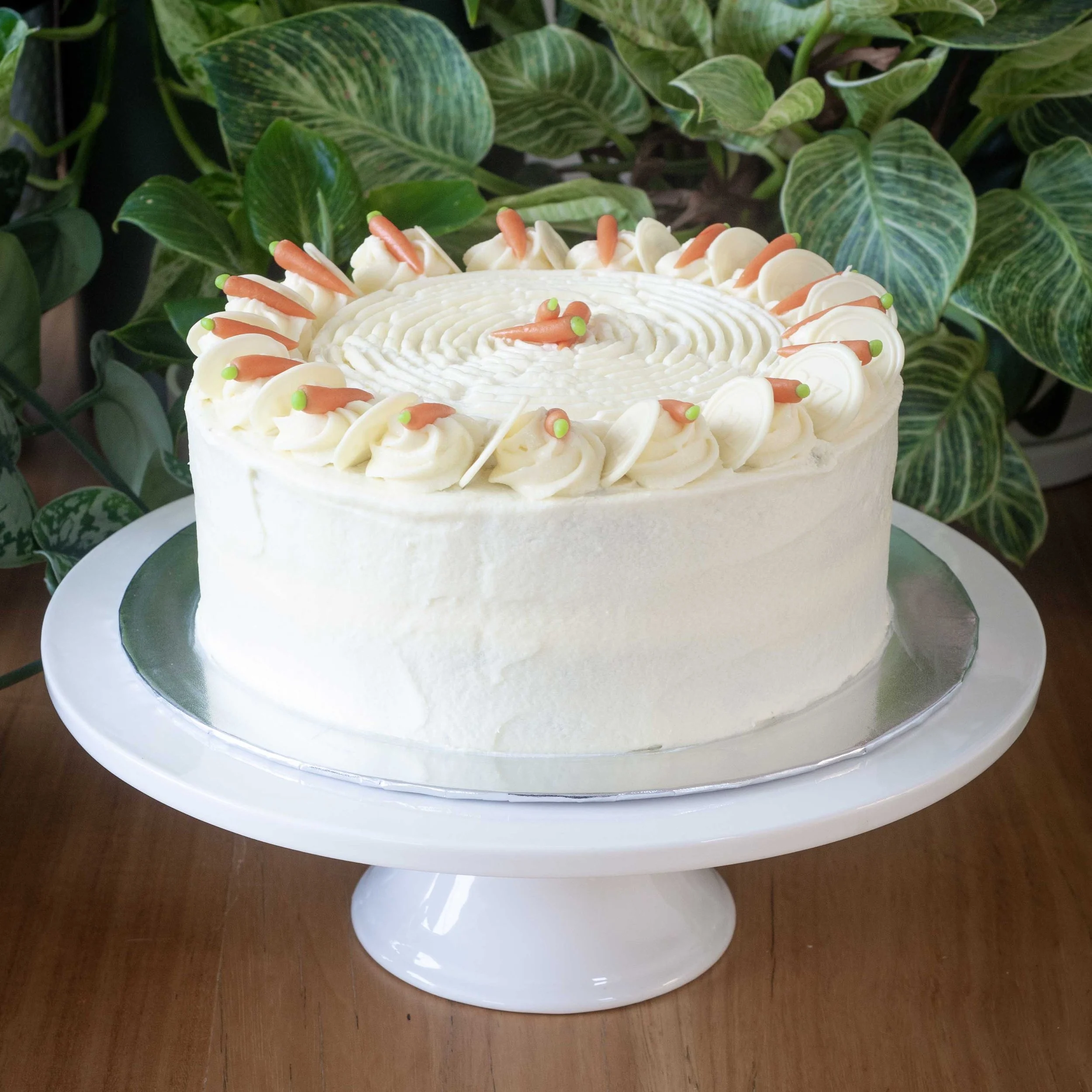 a carrot cake with mini marzipan carrot decorations
