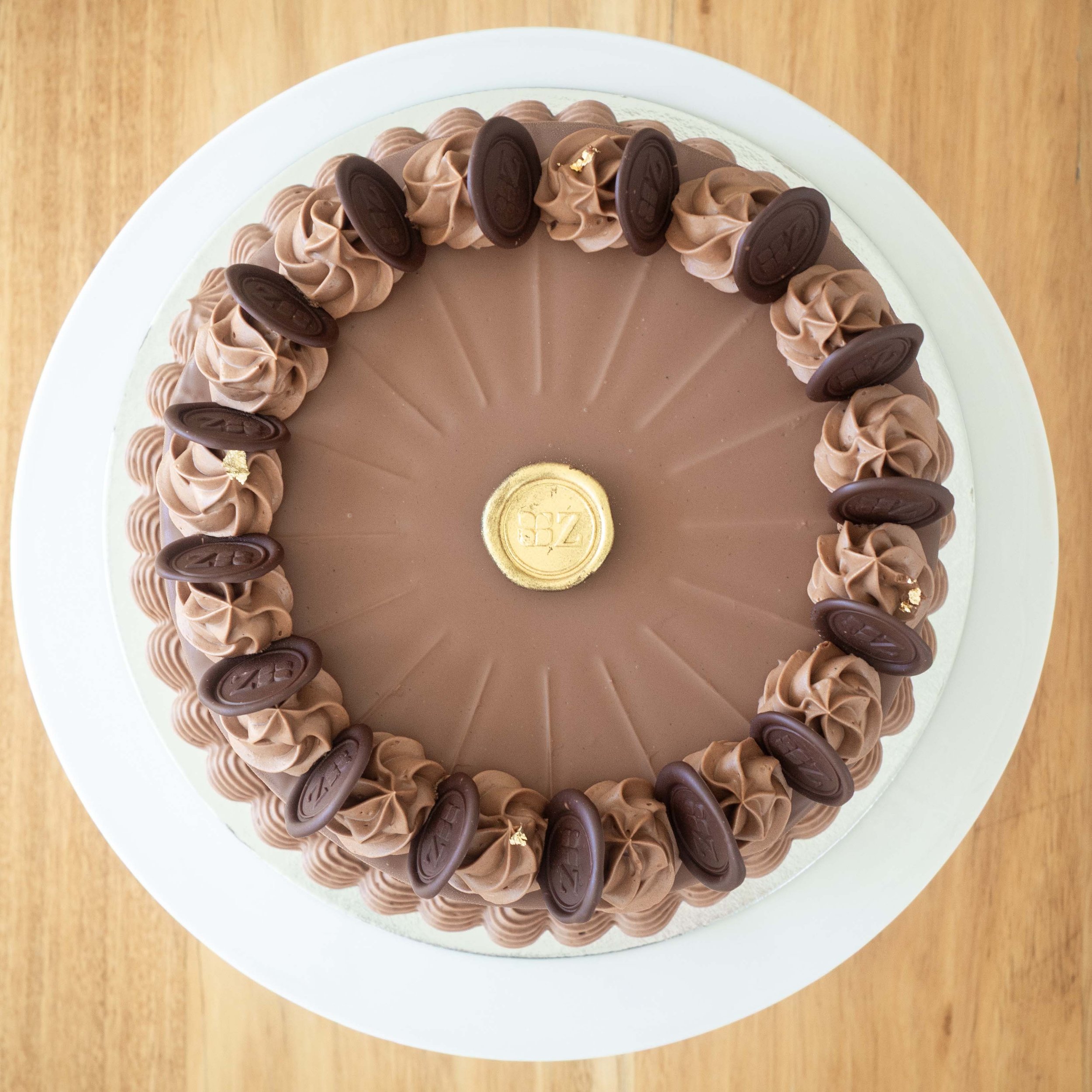 the view from above of a chocolate covered multi layered German Prinzregententorte cake