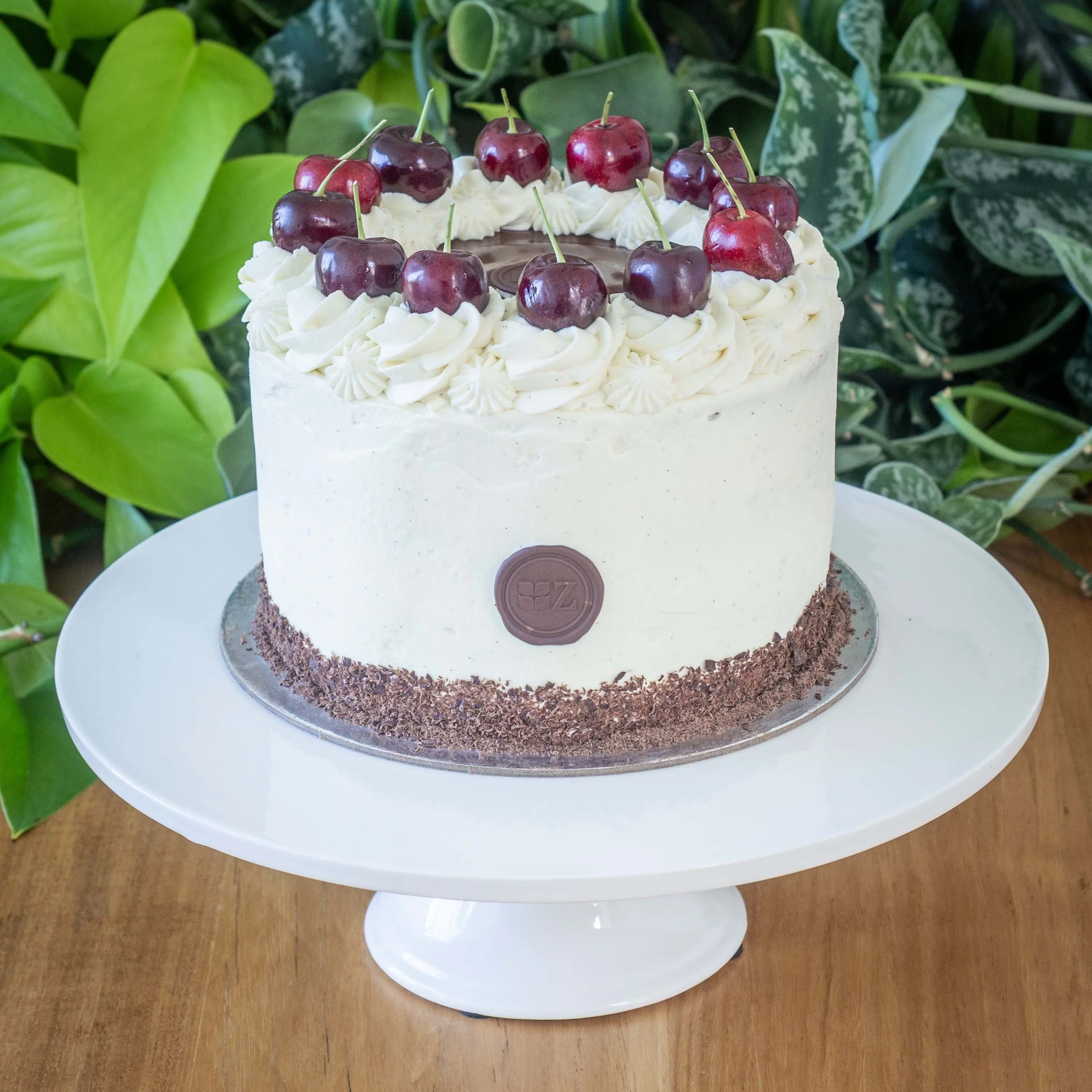 a small Black Forest Cake or Schwarzwälder Kirschtorte with cherries