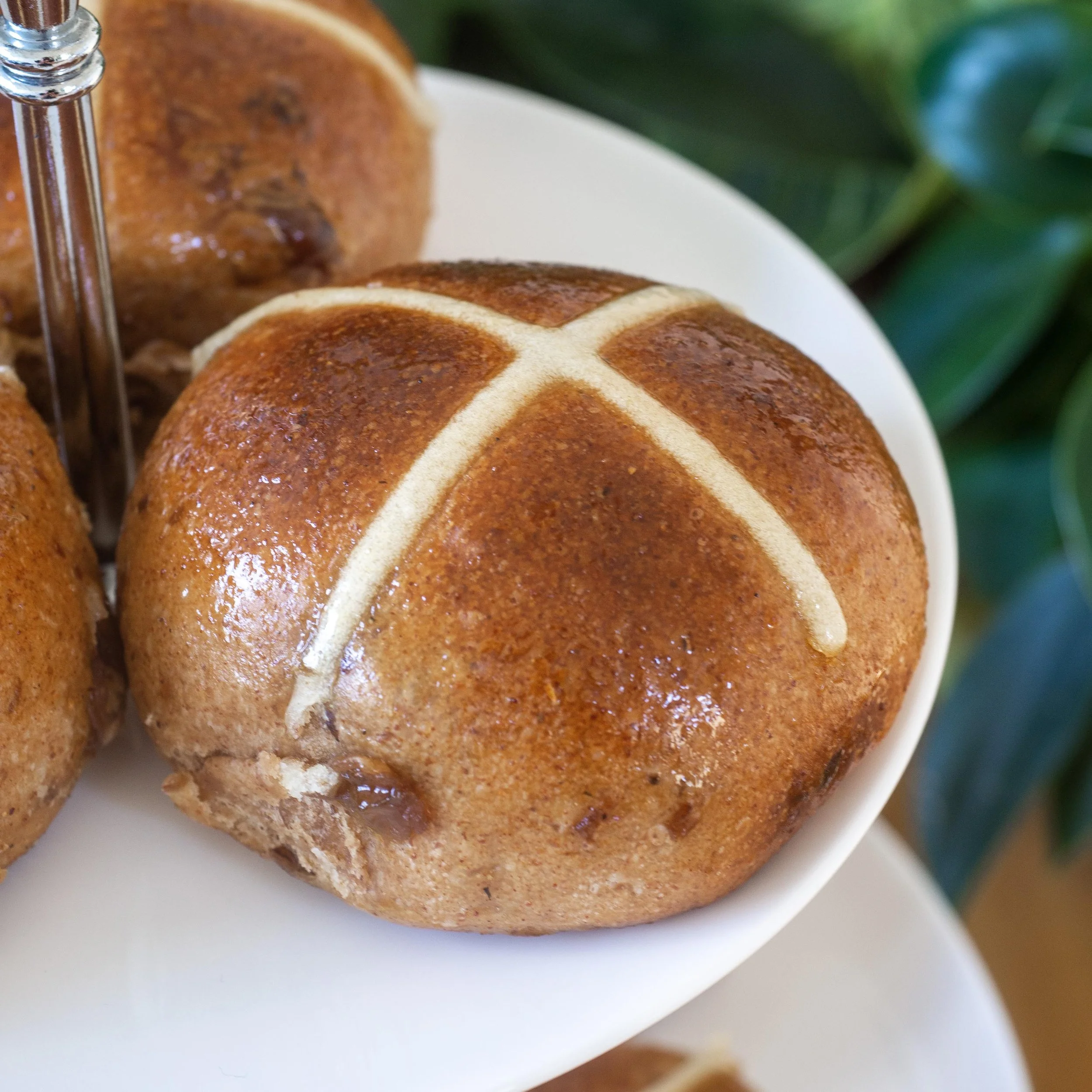 a close up of a hot cross bun