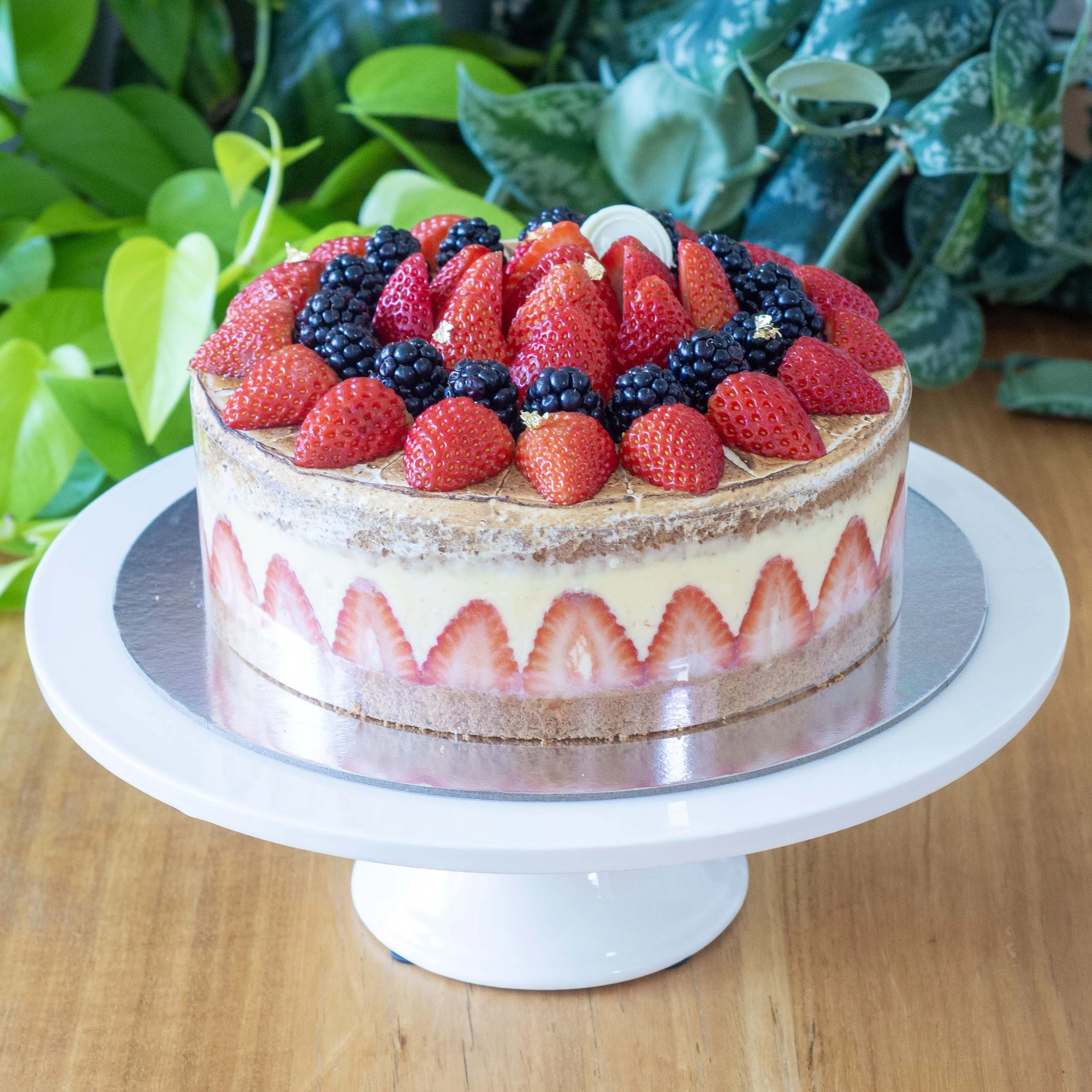 a french strawberry cake or fraisier with visible strawberry decoration
