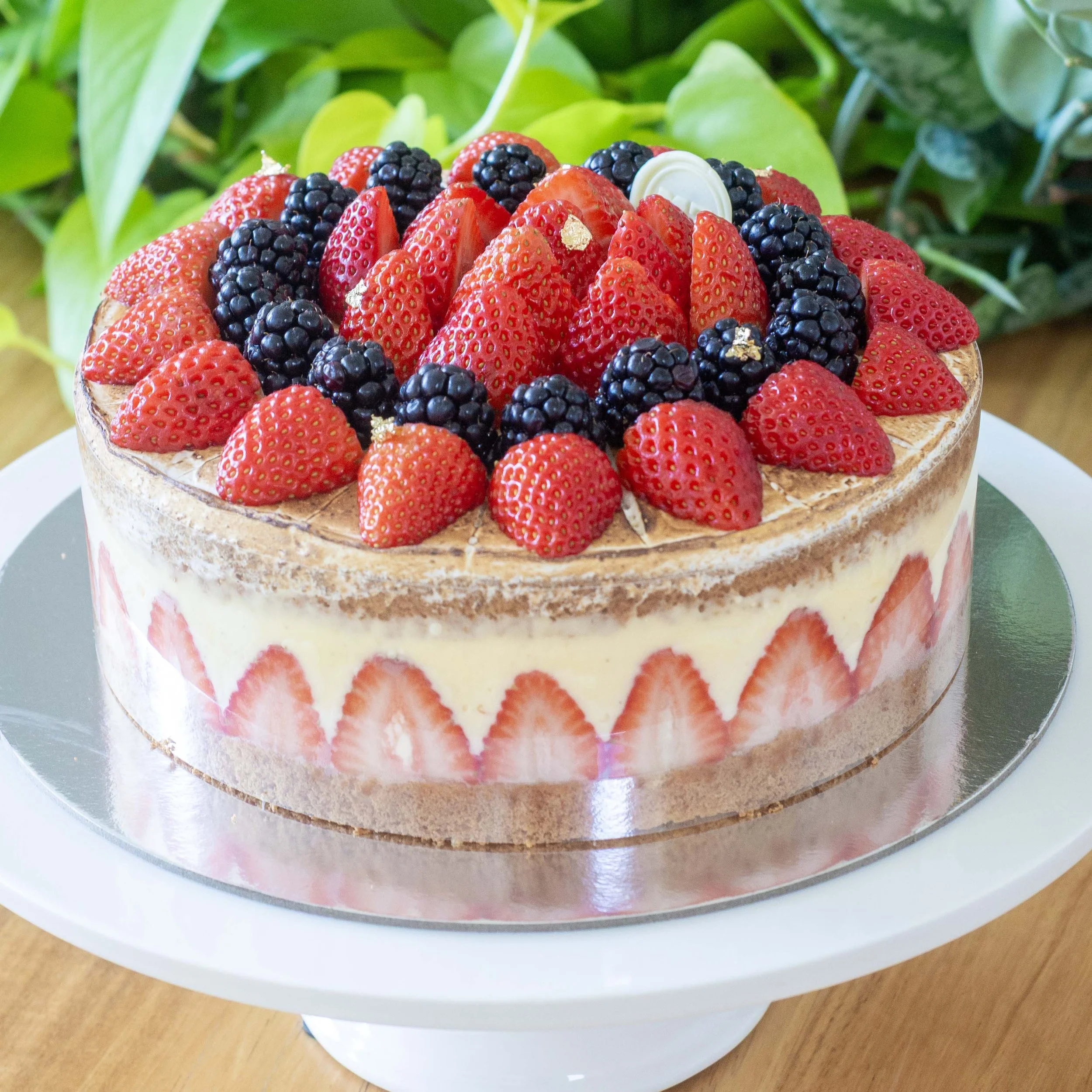 a french strawberry cake or fraisier with visible strawberry decoration