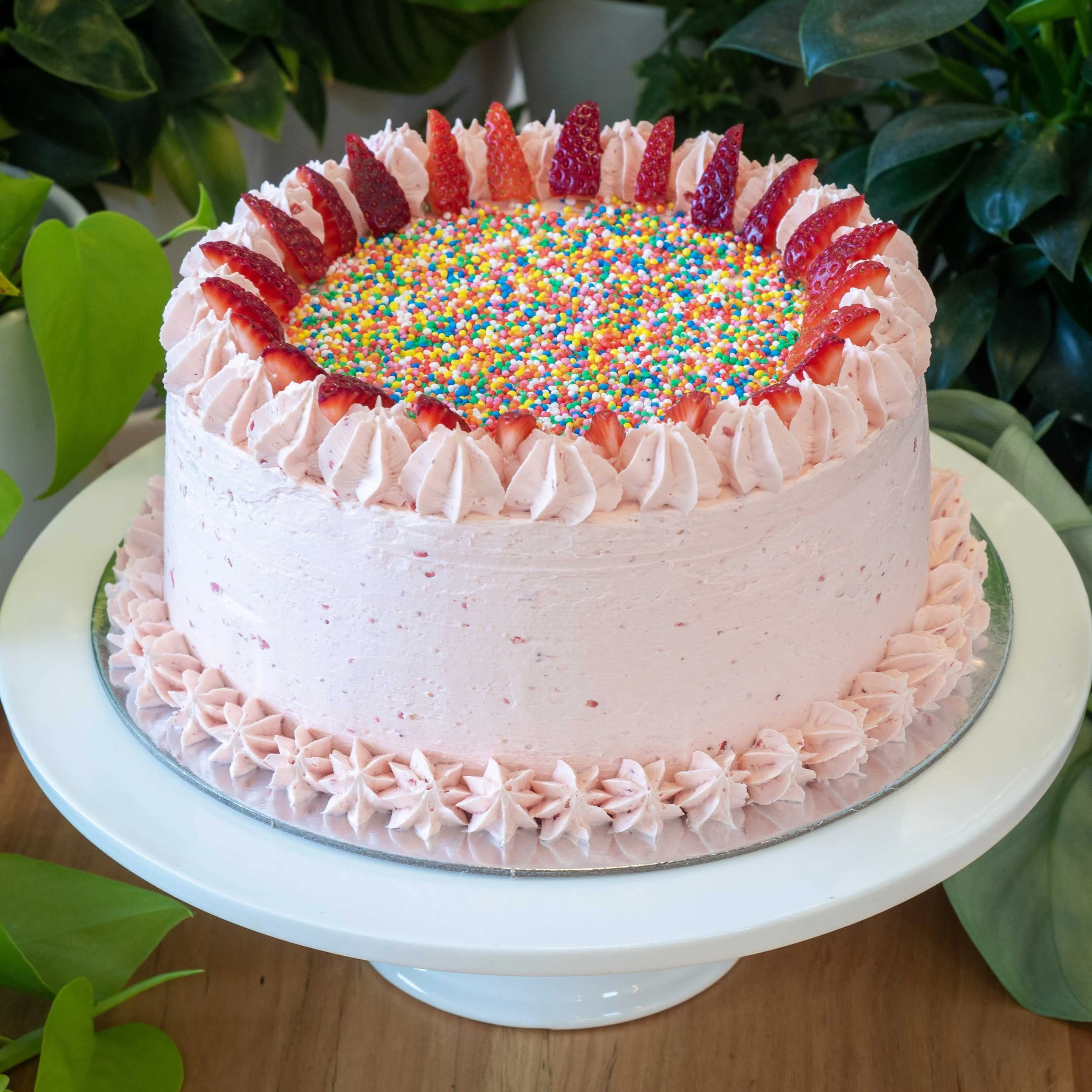 a strawberry cake with sprinkles perfect for kids birthday parties