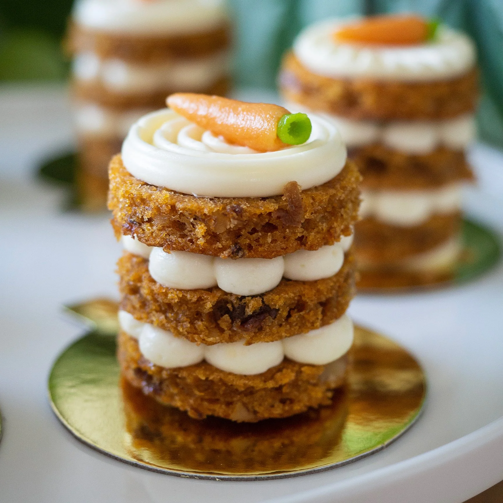 a close up of a carrot cake petit gateau