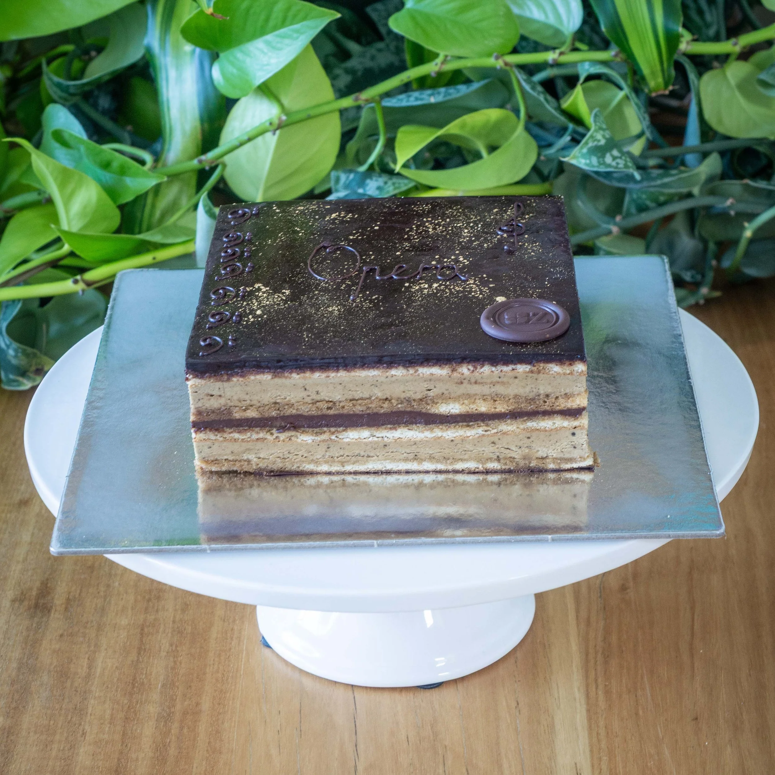 a small version of a multi-layered coffee and chocolate opera cake