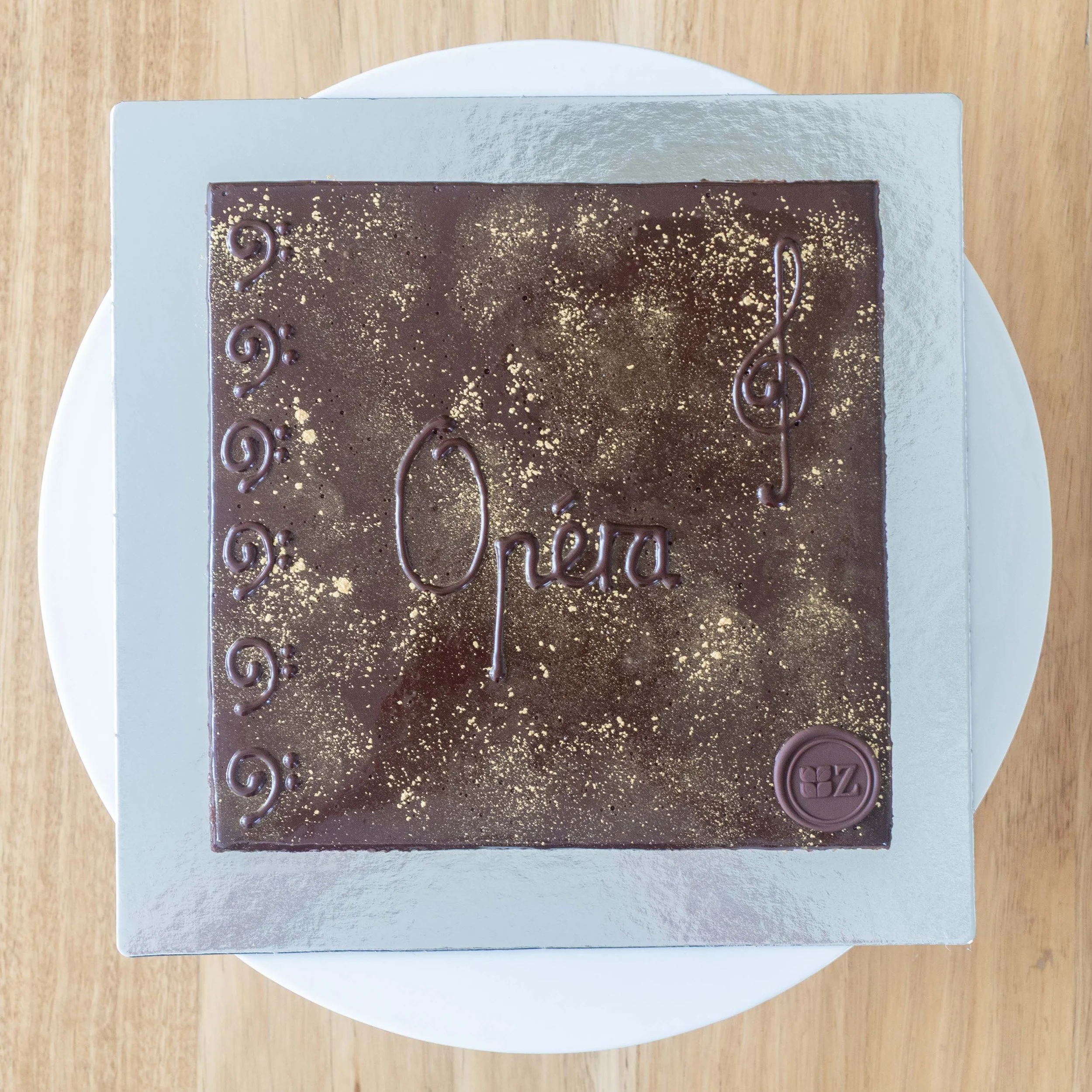 the view from above of a multi-layered coffee and chocolate opera cake