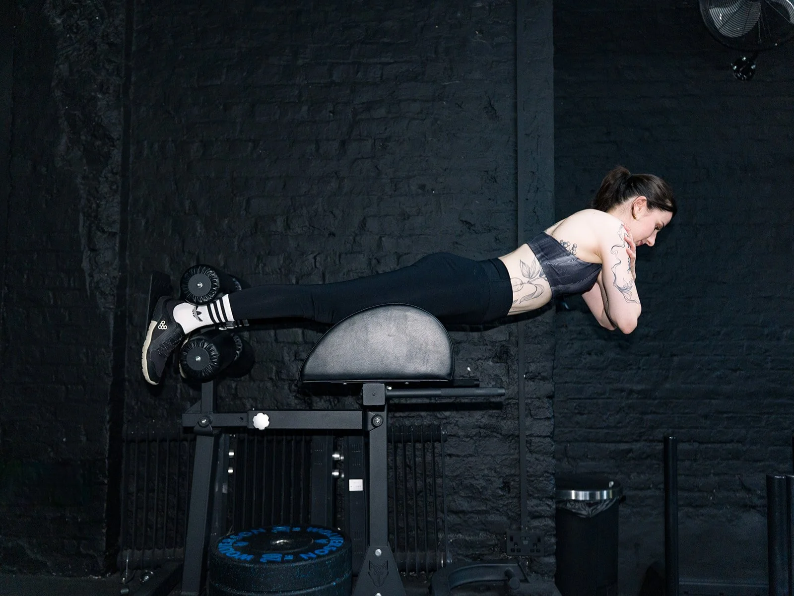 Nicolina performing a back extension exercise on a GHD machine