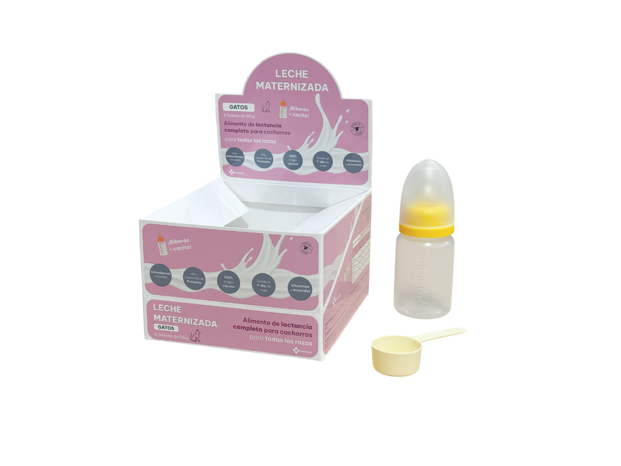 Leche maternizada en un dispensador para gatos, con biberón, tapa y una pequeña cucharita, en una caja rosa y blanca con información y dibujos de leche y gatos.