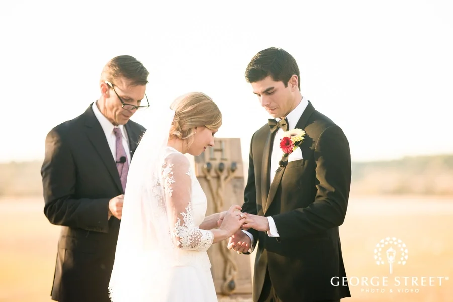 charming_bride_and_groom_ring_exchange_ceremony.jpg.webp