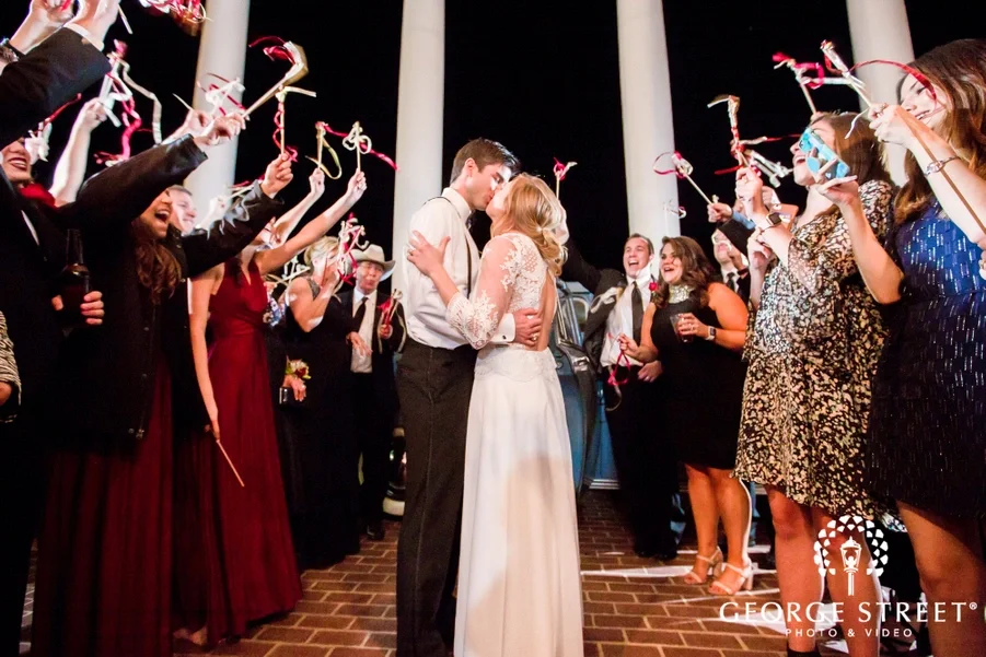 lovable_bride_and_groom_at_reception_exit.jpg.webp