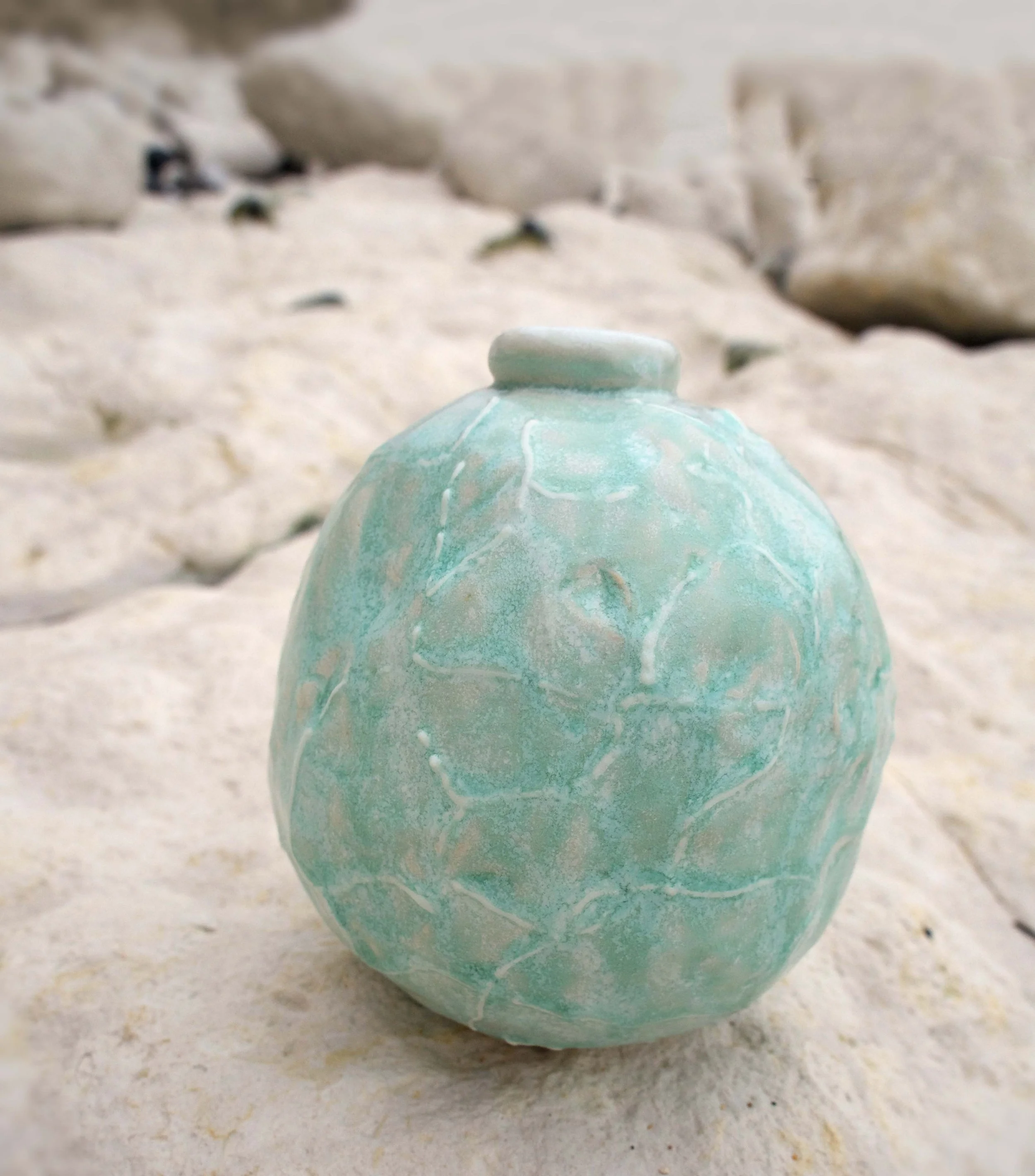 UNPOTE : Ocean Falling Tide No.2 
Handbuilt stoneware vessel shaped by the falling tide, rolled and pressed in ocean shallows. Its pale aqua ash glaze evokes the shimmer of retreating waves and the memory of saltwater light. Porcelain slip and wood a