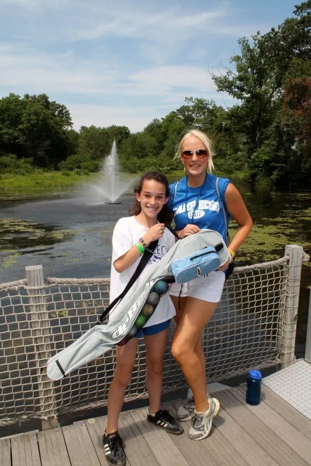 Camp America child, with camp staff memeber, enjoying the day at summer camp USA