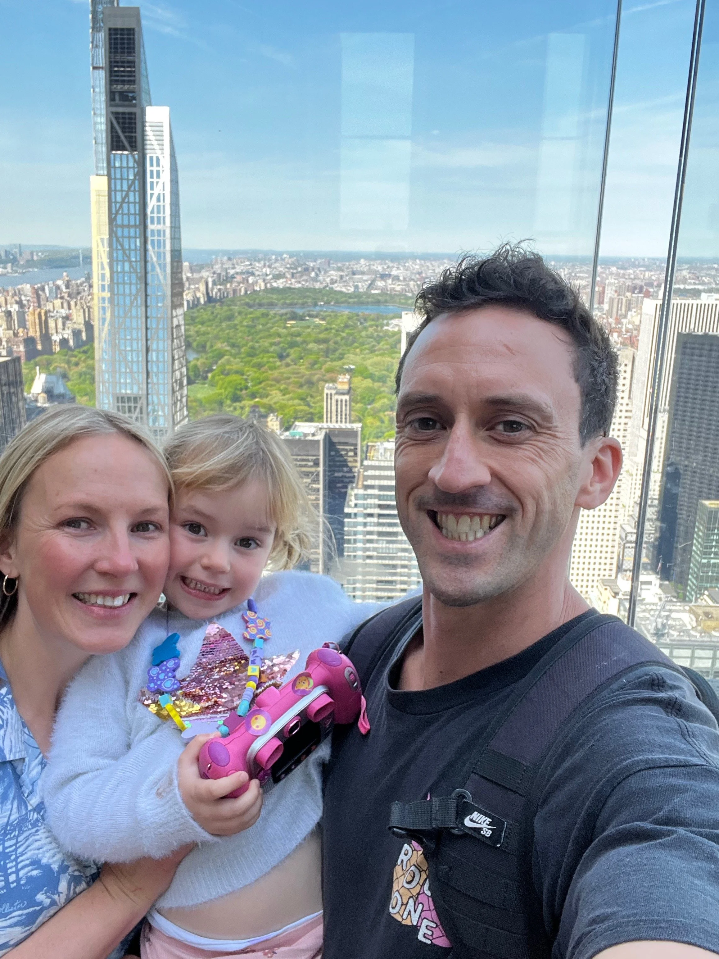 A happy family of three who worked at usa summer camp