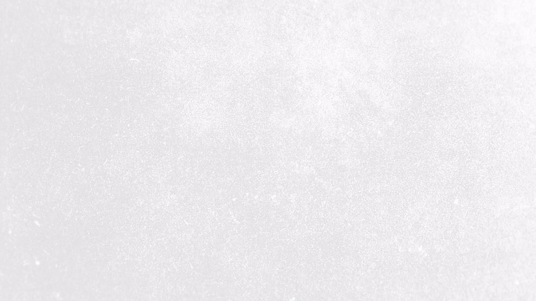 Empty sidewalk covered with snow, no visible people or objects.