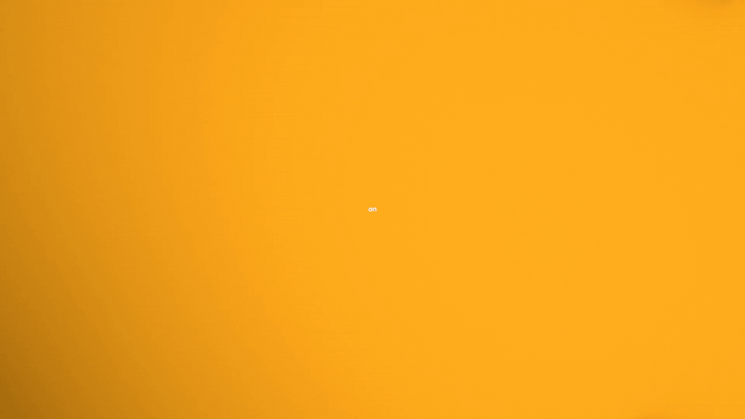 The image features a bright orange background with small white text in the center that reads 'on'.