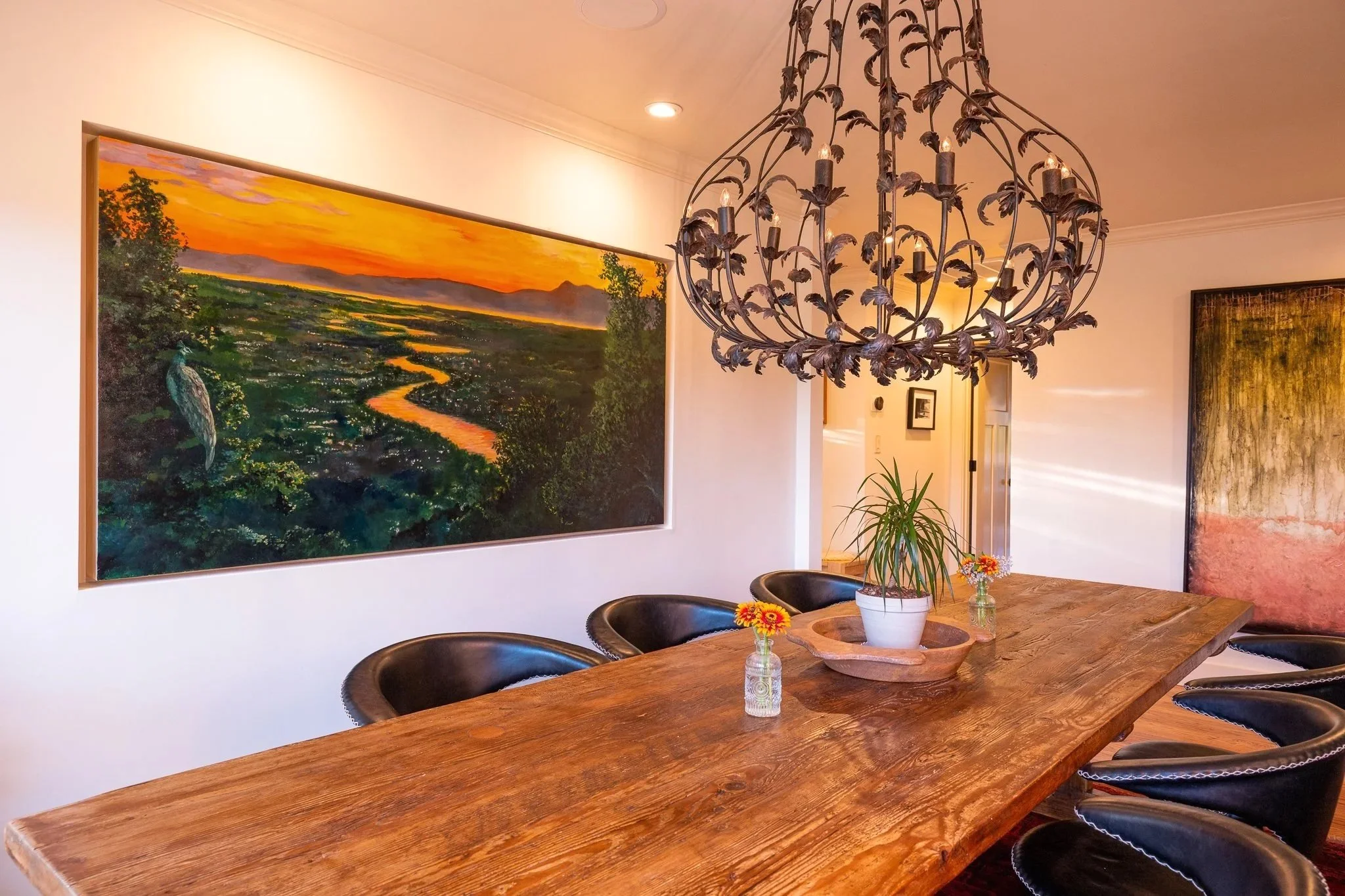River of Light installed in the dining room niche, beside the chandelier and long wooden table