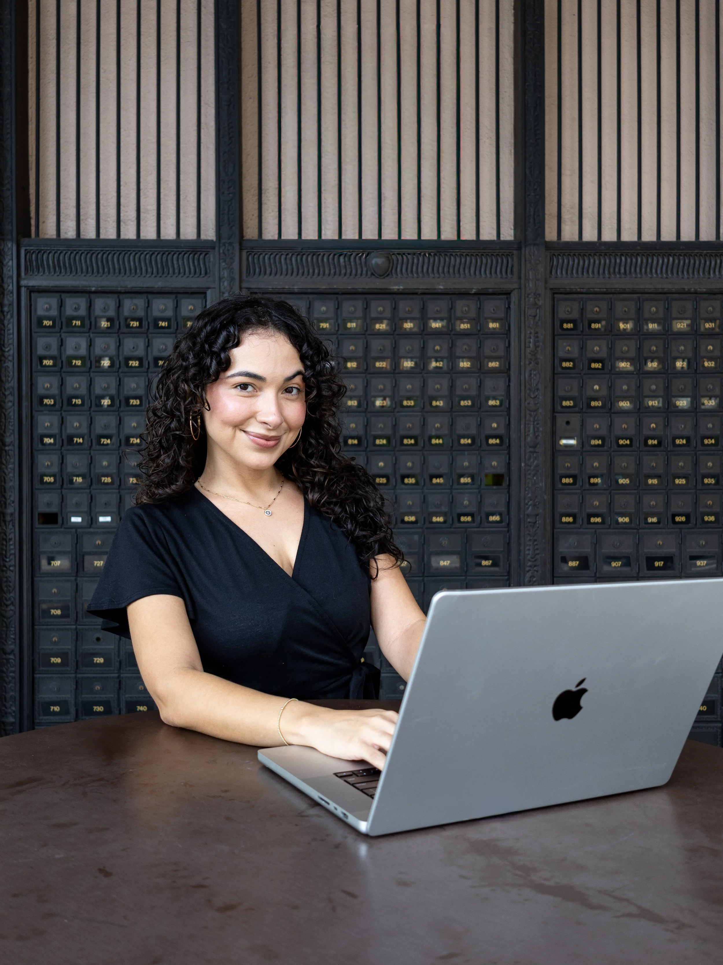 A high-quality portrait from a brand photography session, capturing the personality and professional energy of a Tampa-based entrepreneur in a lifestyle-oriented environment