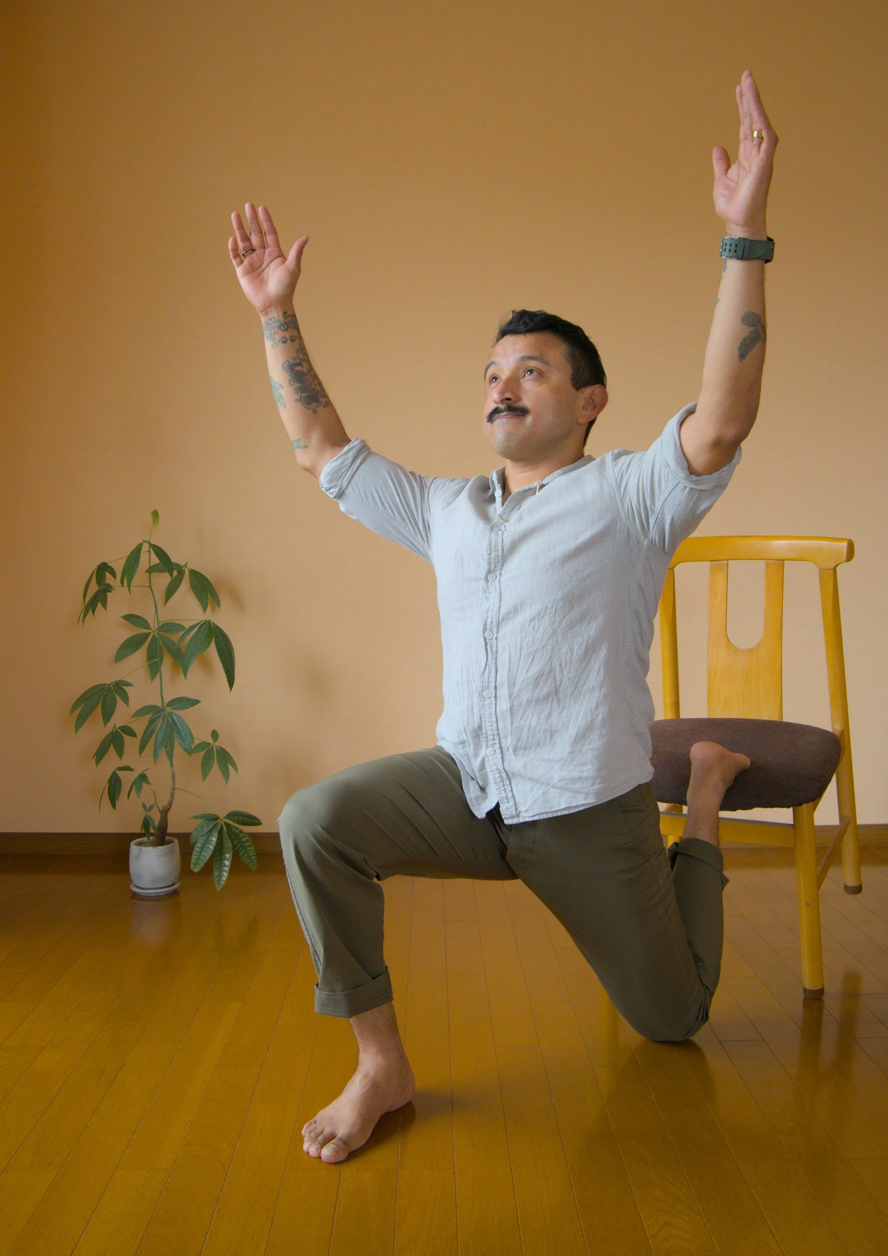 Guy using chair at office to stretch
