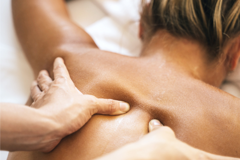 Person receiving a massage on their back.