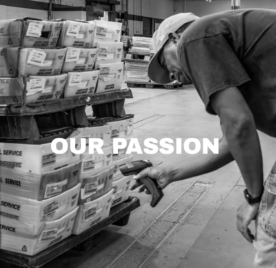 A worker in a warehouse inspects packages on a pallet, holding a handheld scanner. The text "OUR PASSION" is overlaid on the image.
