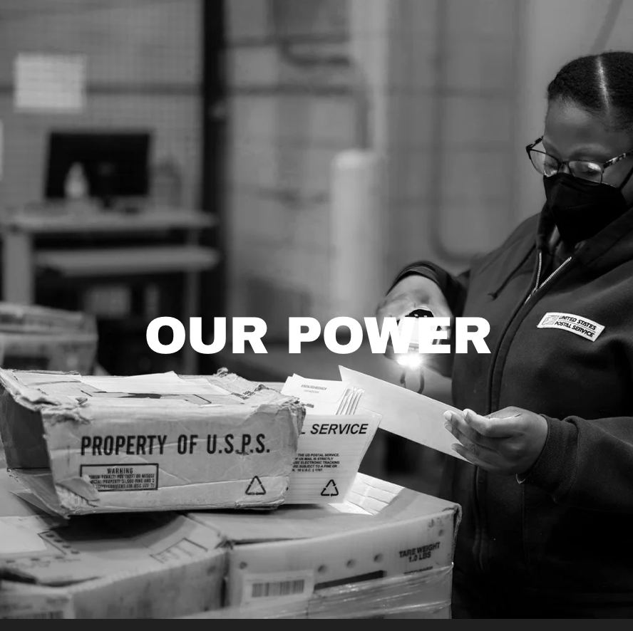 A person with glasses and a mask working with mail and packages at a postal facility, with the words 'OUR POWER' superimposed over the image.